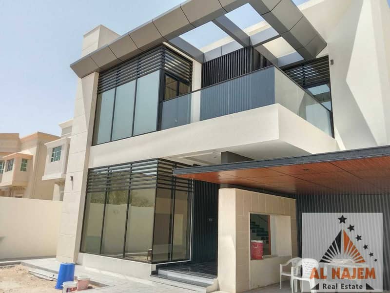 Modern luxury villa for sale without down payment on the main street in Al Rawda 1 area behind Al Hamidiya Police Station in Ajman with the possibilit