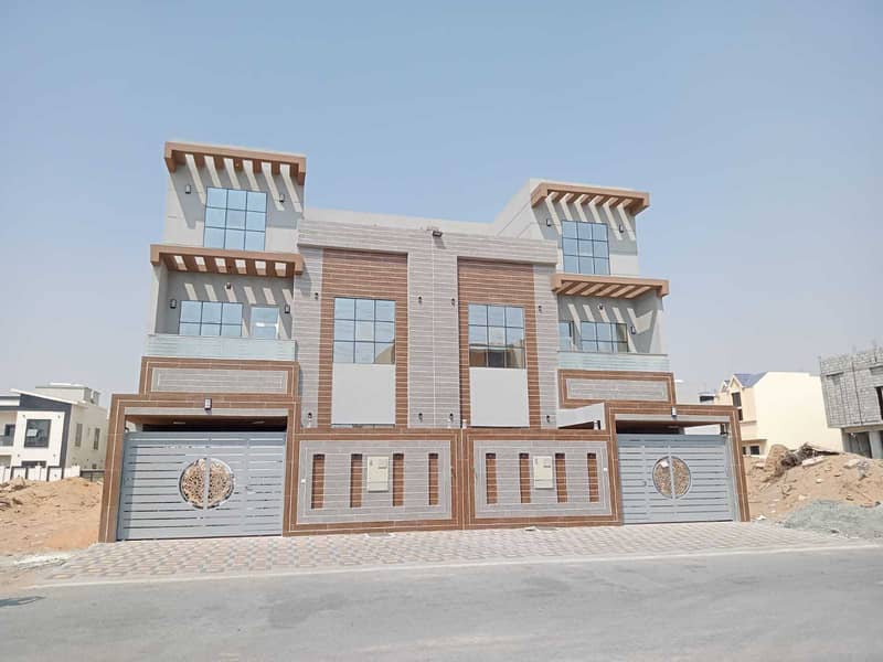 Villa for sale in a modern design, fully finished, Super Dulux, in Ajman, Al Yasmeen area, at an excellent price.