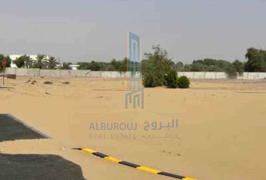 A plot for sale in Al Zahya with no registration fees.