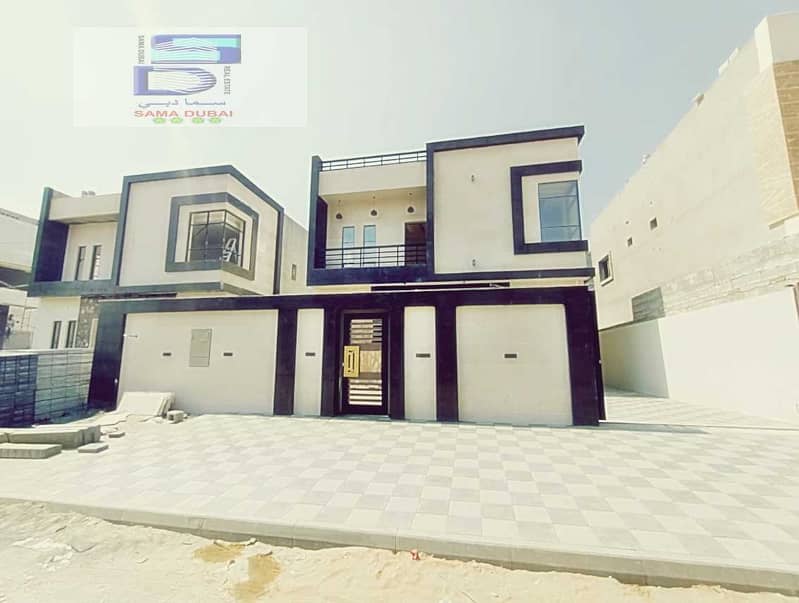 Modern villa for sale in Ajman, Jasmine area, central air conditioning, facing stone, super deluxe finishing, freehold for all nationalities, in a ver