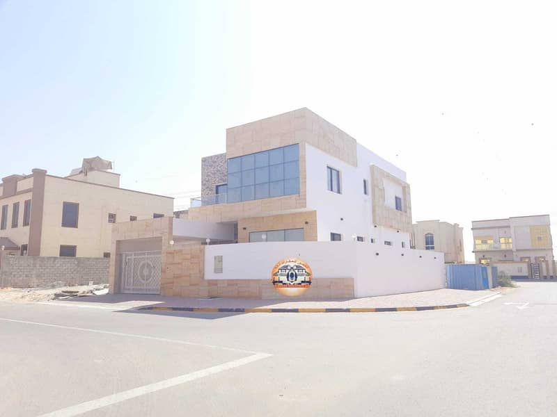 The location of the villa in Ajman, the Jasmine area, two floors, modern design, super deluxe, the corner of two streets, different finishes, on a dir