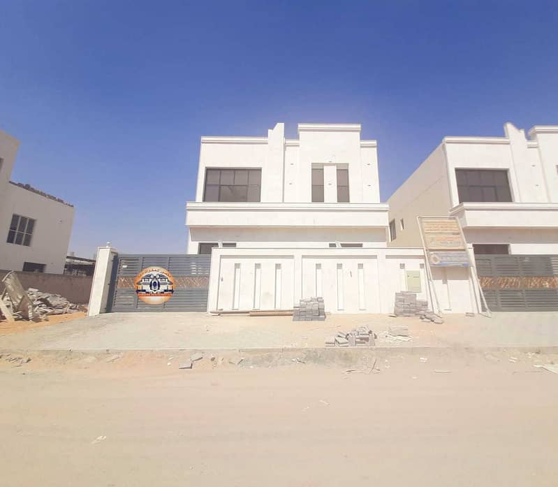 The location of the villa in Ajman, the Jasmine area, two floors, a design of various finishes, central air conditioning, on a direct street, with the