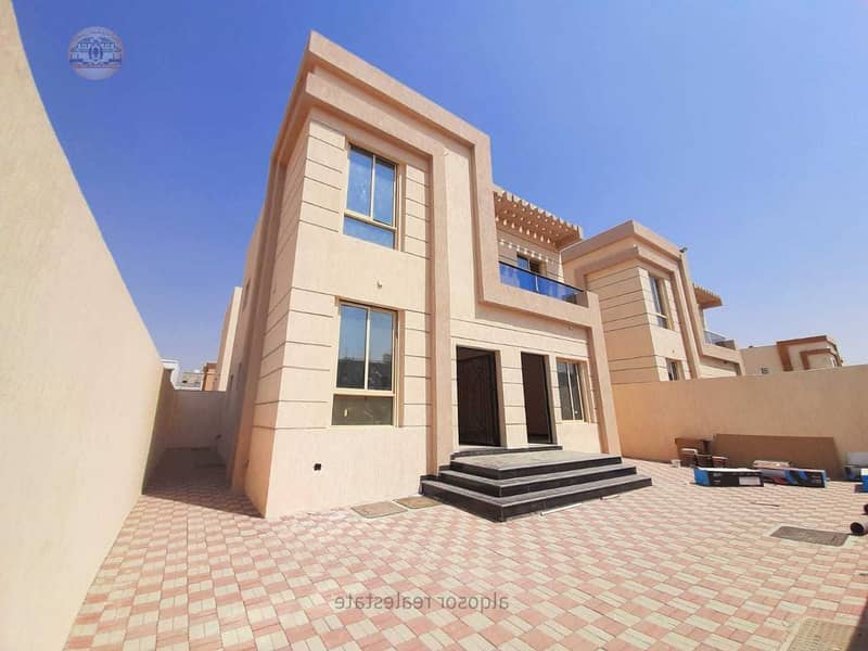 Villa for sale in Ajman at the price of a snapshot on a neighbor street without down payment and in monthly installments for 25 years with large bank