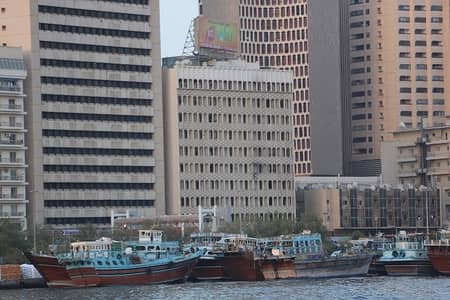 Office for Rent in Deira, Dubai - Studio  office AC free   - Near Metro  Creek Street    - 30,000   + 1 month   - China Tower