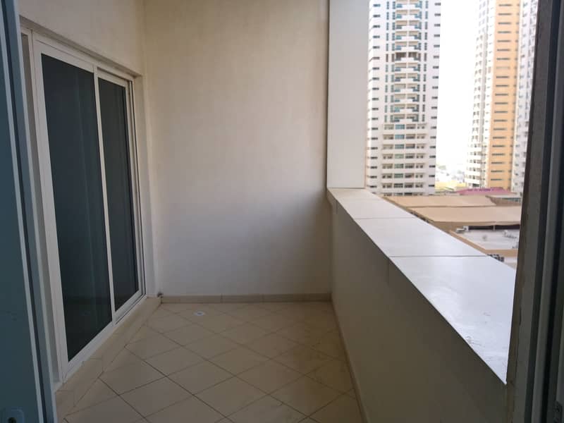 One bedroom and hall for rent in ajman one tower with parking and partial sea view very neat and clean flat