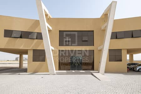 Plot for Rent in Dubai Industrial Park, Dubai - Open Yard fenced W/ office Building in DIC