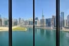 1 Overlooking view of Dubai Canal and Burj Khalifa.