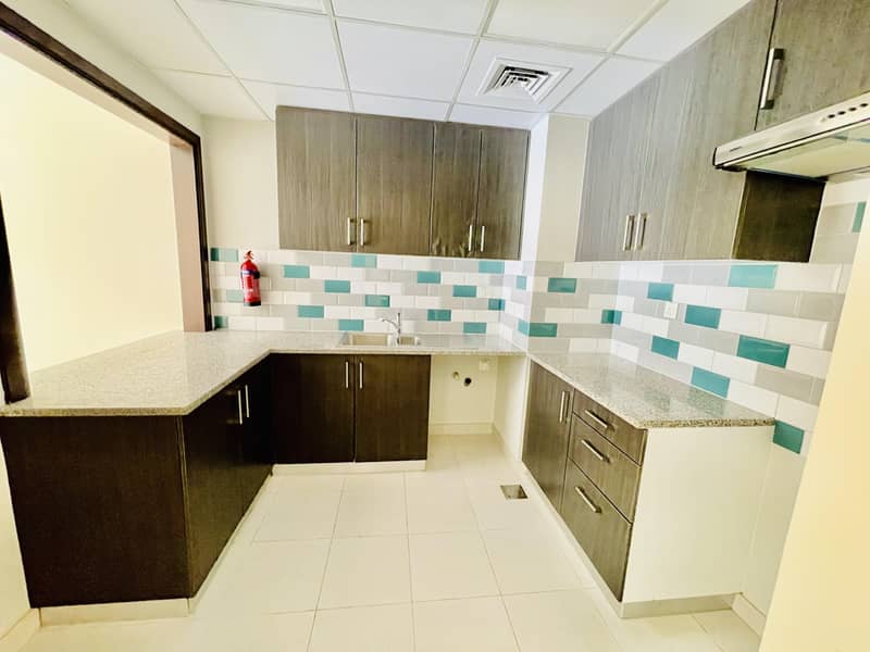 8 Garden View | Elegant apartment | American kitchen | Master bedroom | Front of University of Sharjah Road Al Zahia