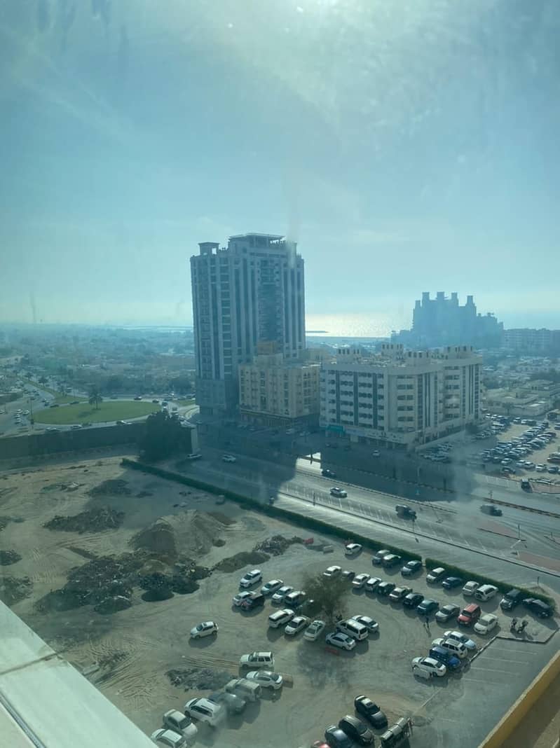 studio partial sea view high floor with parking for sale in Ajman one tower