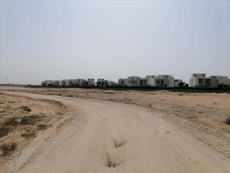 Own a plot to build your villa, direct sea view  in Al Zorah
