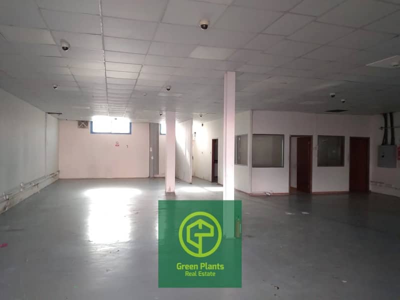 Al Khabaisi 12,000 Sq. Ft warehouse with built in ready offices front & glass showroom in a prime location