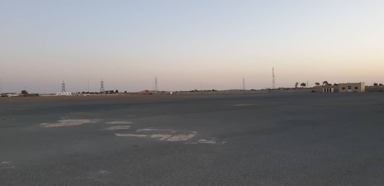 600000 Sq ft Open Land with Concrete flooring available in Emirates Modern Industrial area, Umm Al Quwain. .
