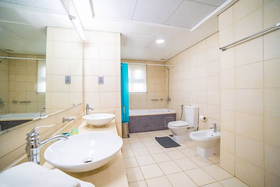 17 Master Bathroom with bathtub and shower cabin