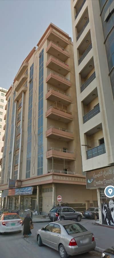Building for Sale in Al Sawan, Ajman - Building for sale ground + 8 floors for sale with an income of 10% freehold