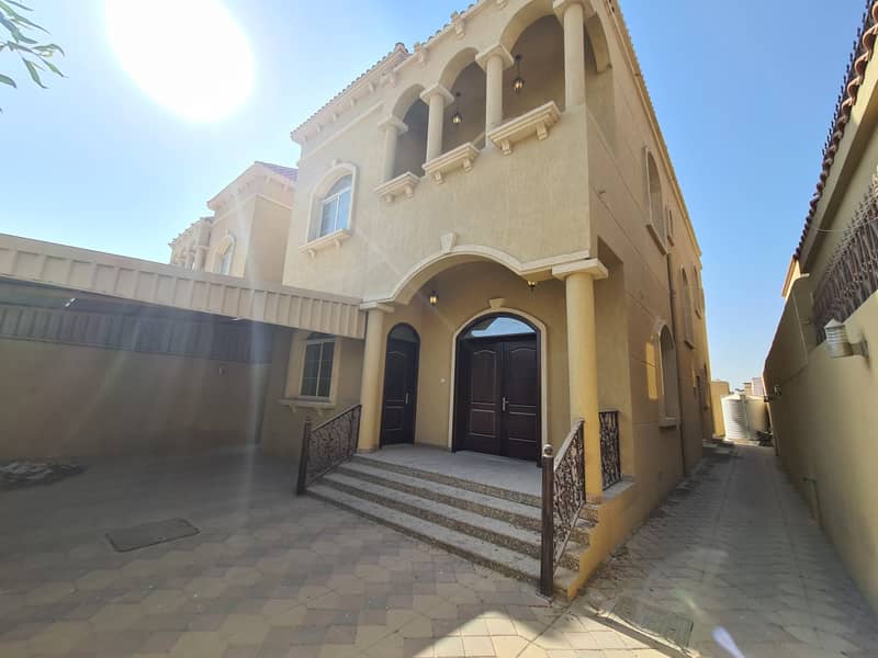 Villa with modern design and stone facade, in Al Mowaihat area, personal finishing