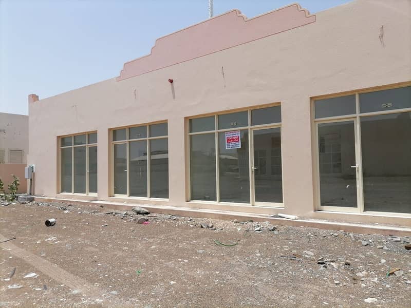 For rent a commercial store in Al Dhaid industrial area without services, suitable for issuing or renewing licenses