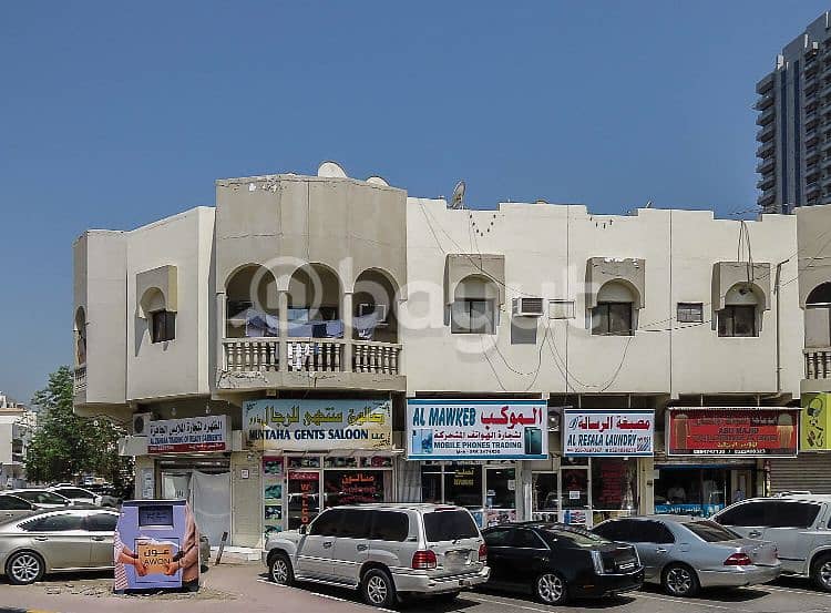 For sale a building in Al Nuaimiya, a great location, and a good income