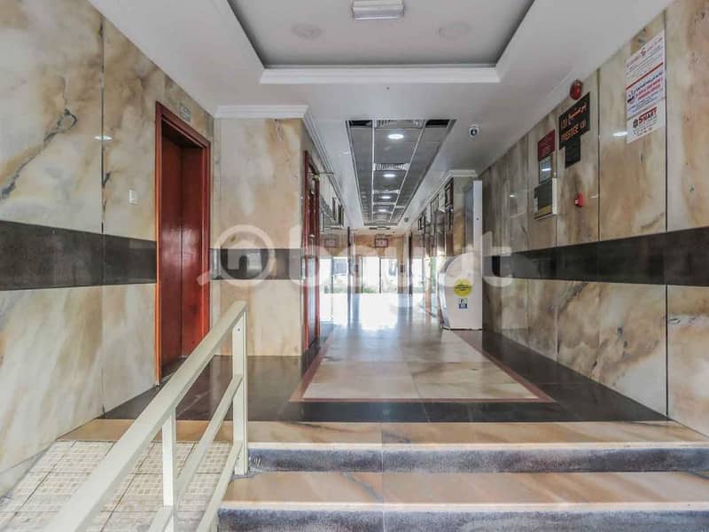 For sale a new building in Ajman on Sheikh Ammar Street, residential and commercial, with an income of 1.4 million, 12.5 million dirhams required