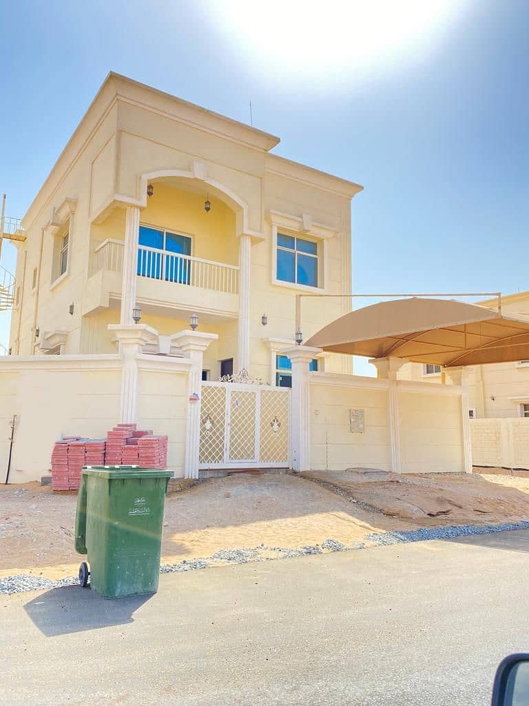 Villa for rent in Ajman, Jasmine area, two floors on the asphalt street, with a car canopy, excellent location