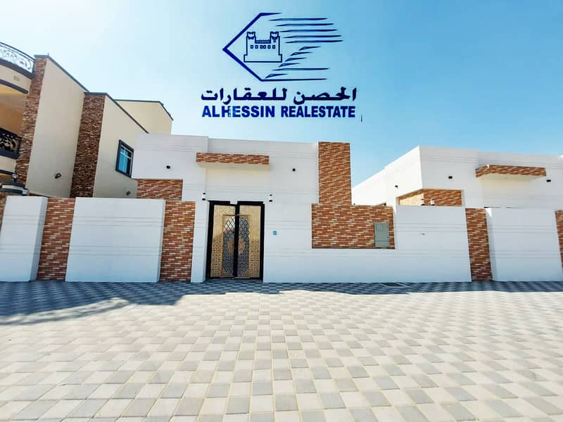 villa with a large building area close to a mosque in the Al Zahia area