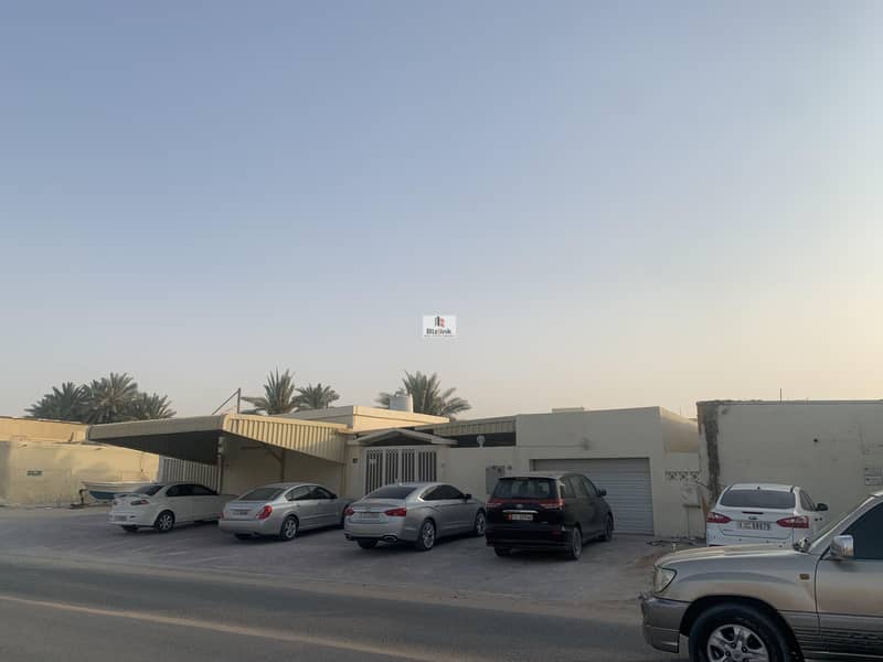 For sale villa in Sharjah, Al Ghafia area, corner of the area 9600 feet, Qar Street, close to the private school complex