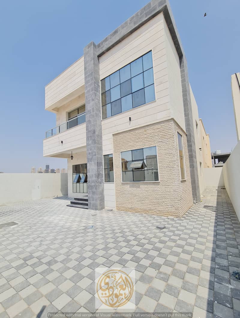 Magnificent villa in Al-Amrah for sale 3 large master rooms, central air conditioning, stone front, close to Sheikh Mohammed bin Zayed Street