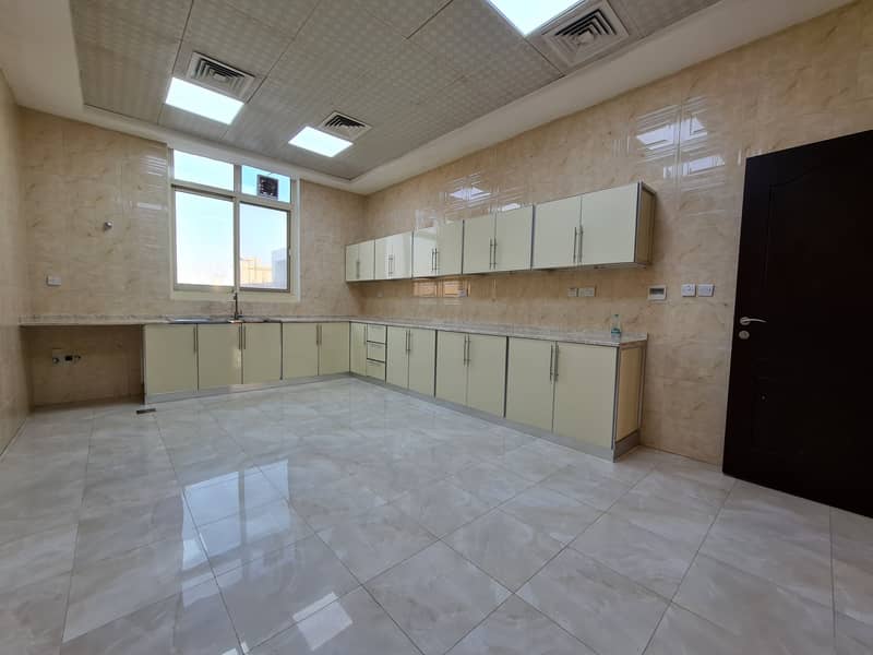EXTRA SPECIOUS 5 BED ROOM HALL WITH PARKING 120K FREE UTILITIES AT MOHAMMED BIN ZAYED CITY