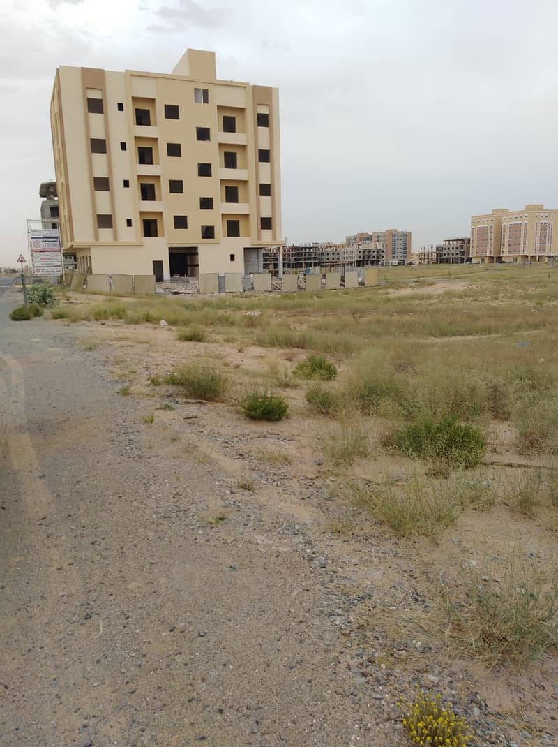 A plot of land for sale, residential, commercial, corner of two straight streets, in the Al Jarf area in the Emirate of Ajman, at an affordable price