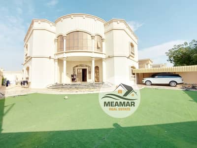 Two-storey villa for rent in Ajman, Al Hamidiya area, large areas with central air conditioning, the villa is a corner of two streets, an excellent lo