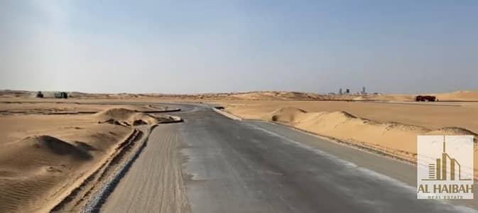 Mixed Use Land for Sale in Rodhat Al Qrt, Sharjah - For sale commercial land, ground + 2 in Rodhat Al-Qurt , installments system, prices from 390,000