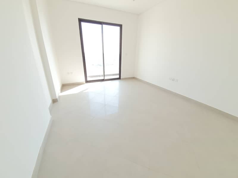 Hot offer brand new 2bhk with balcony 3 washrooms 1 parking rent just 490000 in 12 payments Aljada area