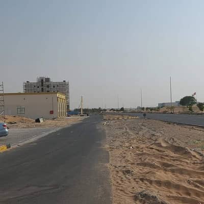 Mixed Use Land for Sale in Al Alia, Ajman - A great investment opportunity to own a commercial plot of land in installments for 3 years and exemption from registration fees