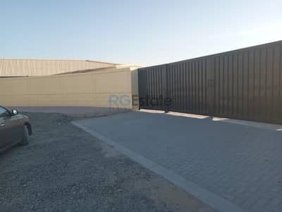 Plot for Rent in Jebel Ali, Dubai - 10,450 Open land with shed and office Brand New