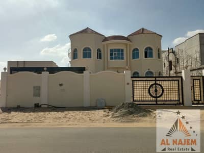 5 Bedroom Villa for Sale in Al Raqaib, Ajman - Selling a new villa, the first inhabitant, without the down payment, central air conditioning, on the main street in Al Raqaib area in Ajman, with the