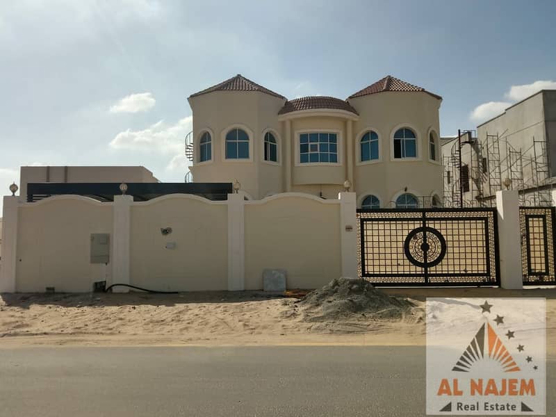 Selling a new villa, the first inhabitant, without the down payment, central air conditioning, on the main street in Al Raqaib area in Ajman, with the