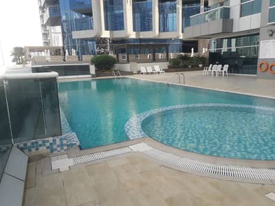 فلیٹ 1 غرفة نوم للايجار في الخليج التجاري، دبي - Swimming Pool