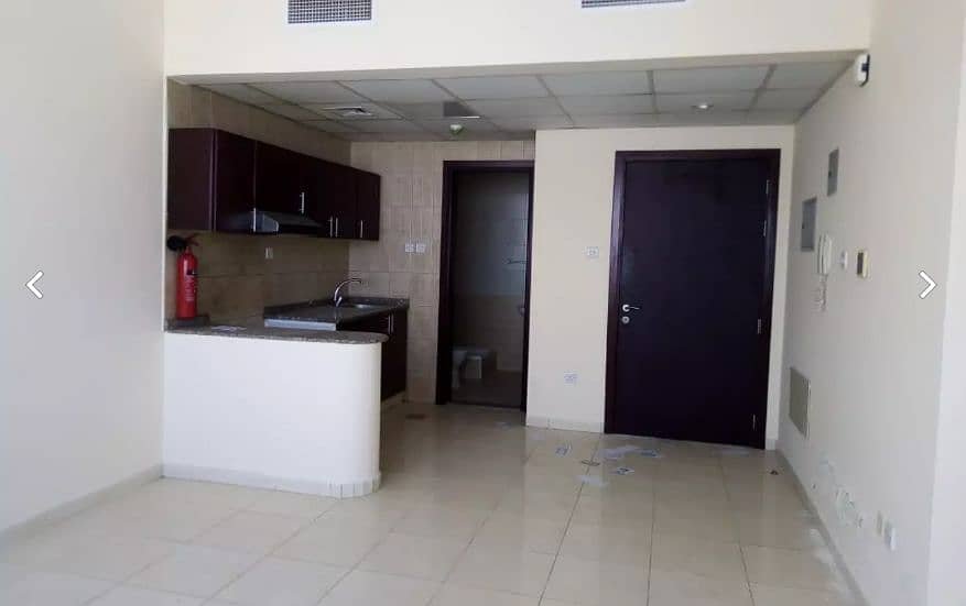 To Let Spacious Studio, open kitchen with fitted cabinets in Gulf Pearl Tower, located in Al Nahda Sharjah 18.000 Yearly