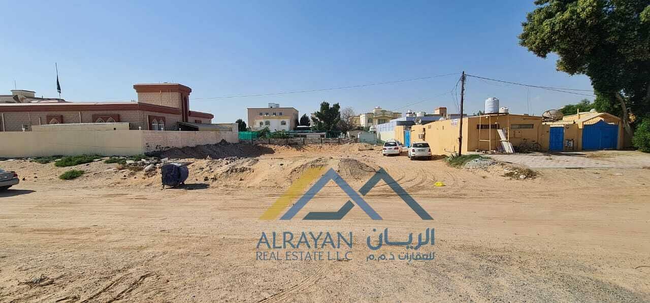 Residential land for sale in Al Mowaihat 2, an excellent location near the street, suitable for building two villas
