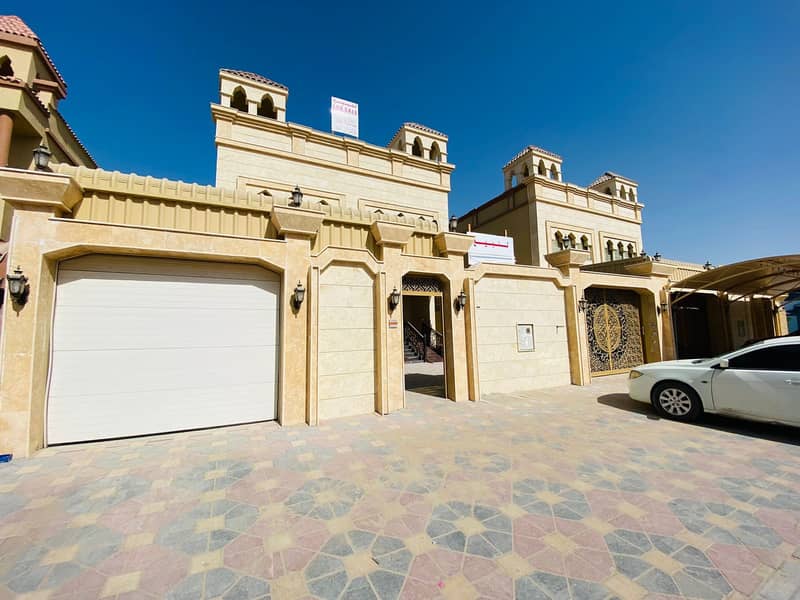 For sale villa in Ajman, excellent location, wonderful finishing, without down payment and in monthly installments for 25 years, with large bank facil