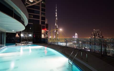 شقة 2 غرفة نوم للايجار في الخليج التجاري، دبي - شقة في برج فالكون الخليج التجاري 2 غرف 90000 درهم - 5542806