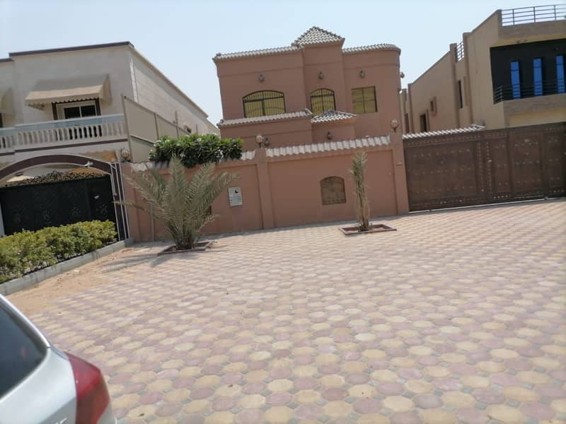 Villa for sale  in Ajman, Al-Mowaihat area, two floors, Fewa & sewage paid , with the possibility of easy bank financing