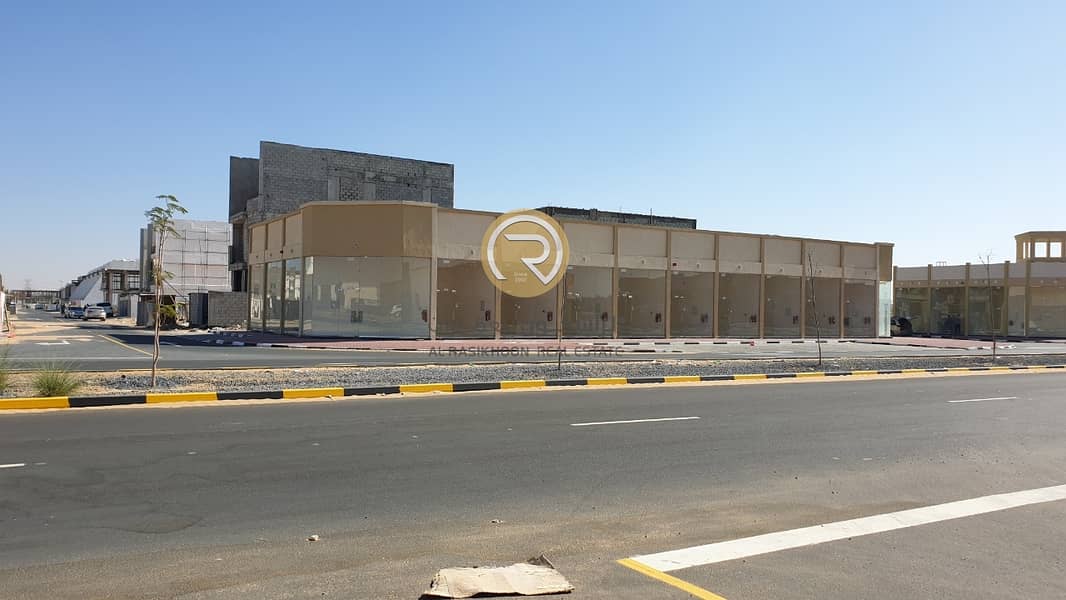 For sale residential and commercial building on two corners in Al Maha Village Al Zahia project - Ajman