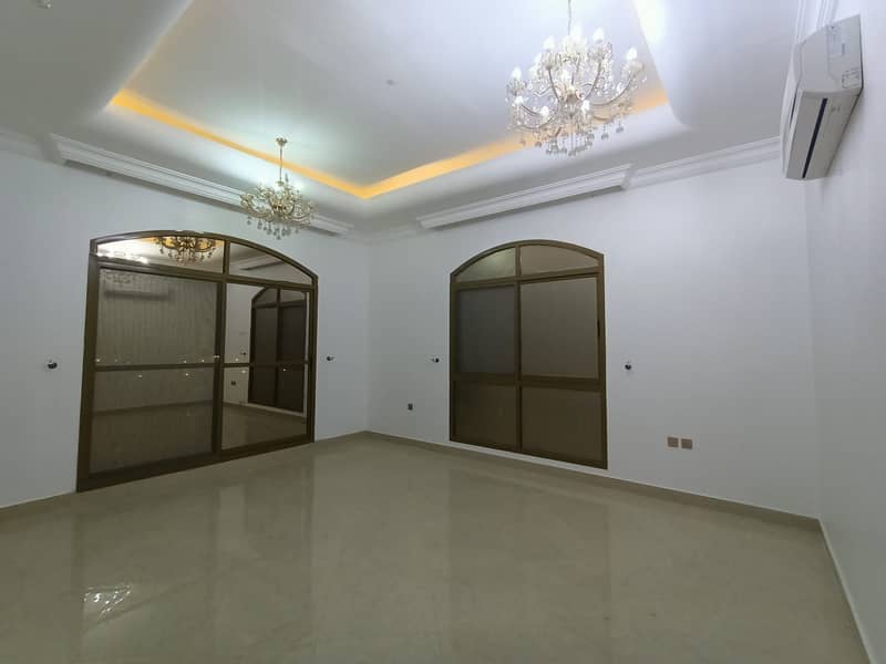 Villa for sale in Ajman, commercial residential, on Qar Street, with electricity and air conditioners