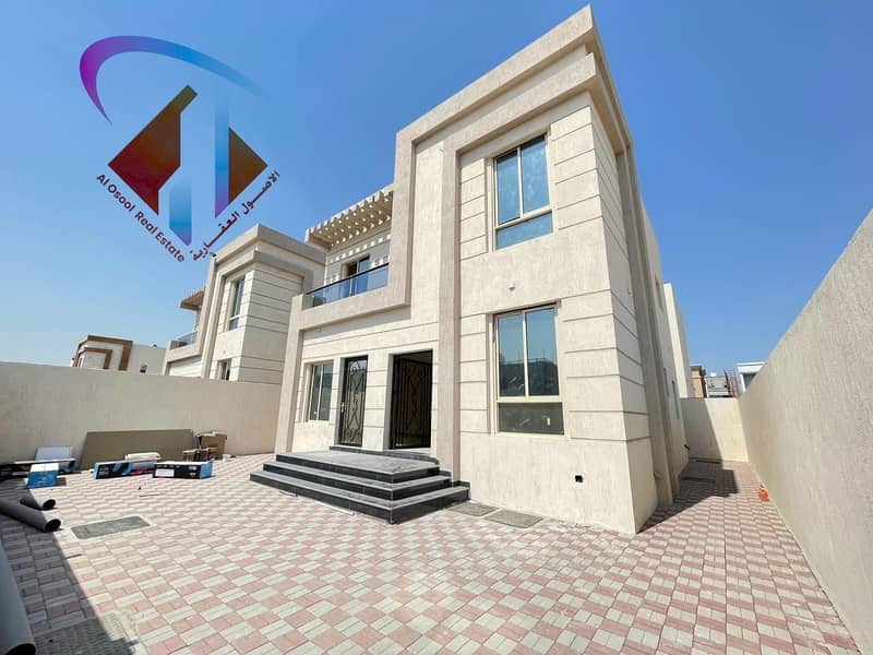 Villa for sale in Ajman at the price of a snapshot on a neighbor street without down payment and in monthly installments for 25 years with large bank