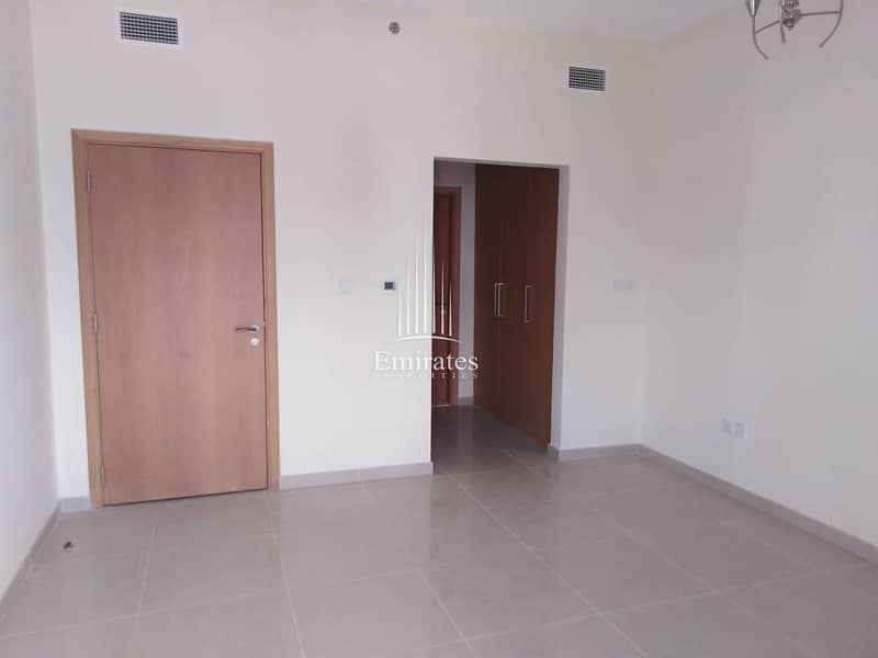 In the heart of JVC. , Unfurnished spacious studio in May residence,