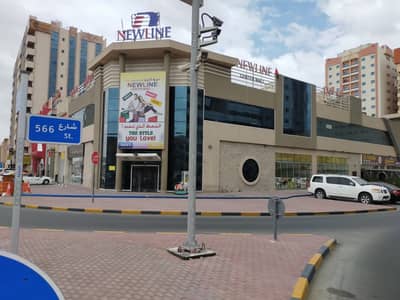 Showroom for Rent in Al Nuaimiya, Ajman - Mall in Ajman, Al Ittihad Street, Main Street a very special vital location on the corner of the central air conditioning, with a parking basement