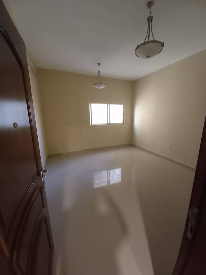 For rent in Ajman studios, separate kitchen, Al Jurf 3, first inhabitant building, with one  free month