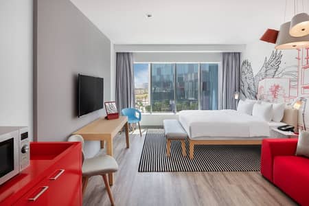 شقة فندقية  للايجار في واحة دبي للسيليكون، دبي - شقة فندقية في فندق راديسون ريد واحة دبي للسيليكون 96000 درهم - 5265390