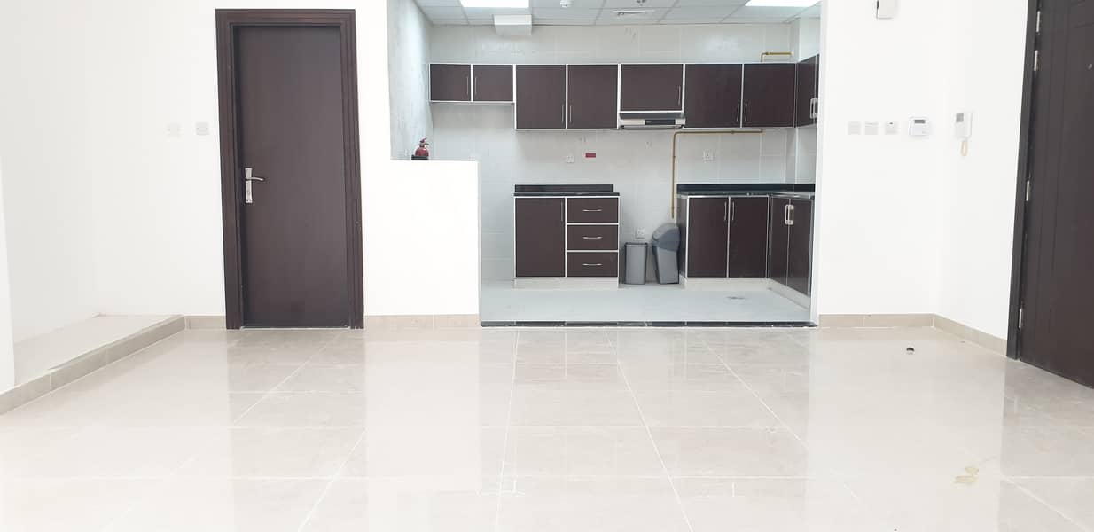 Brand new building 2month free + kitchen with appliances spacious studio apartment available with all facilities rent only AED 28k