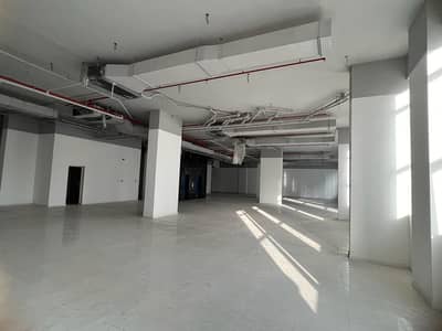 Building for Rent in Corniche Ajman, Ajman - A commercial mall, a new building without commission from the owner, an area of ​​9000 meters, two floors, ready for any commercial activity
